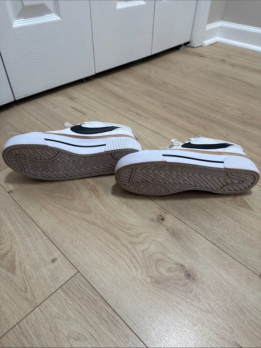 Nike Women’s White Sneakers with Black Swoosh and Tan Accent